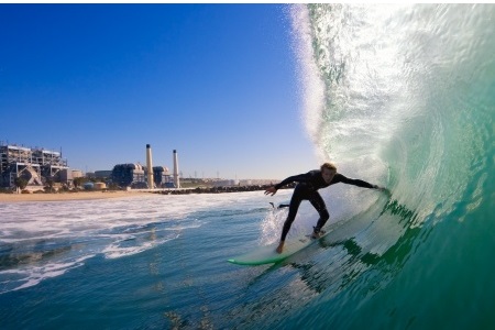 Surfer riding a wave – find surfing partners across Australia on Sports Match Maker